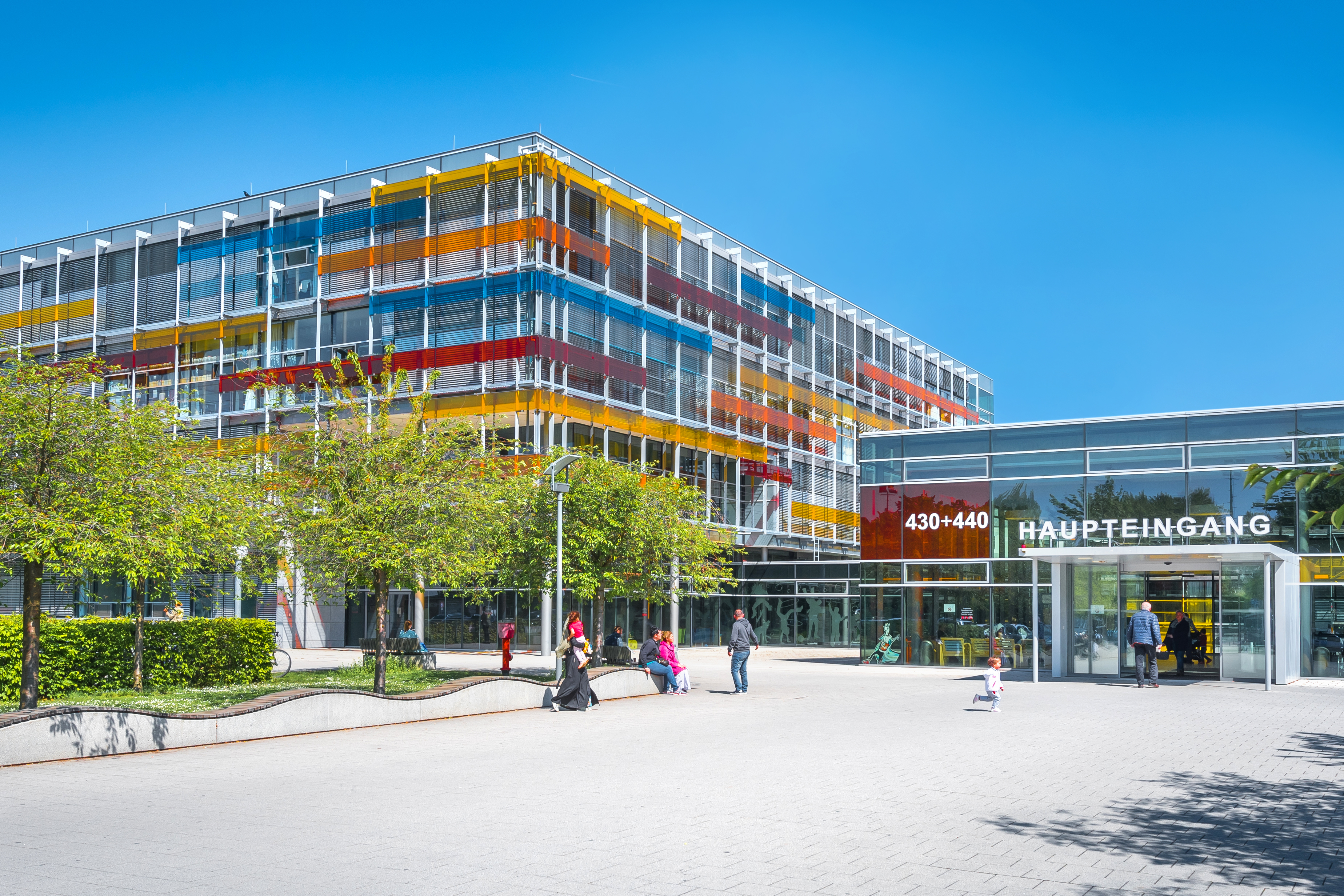 Exterior view of the children&rsquo;s hospital with a colourful glass fa&ccedil;ade.