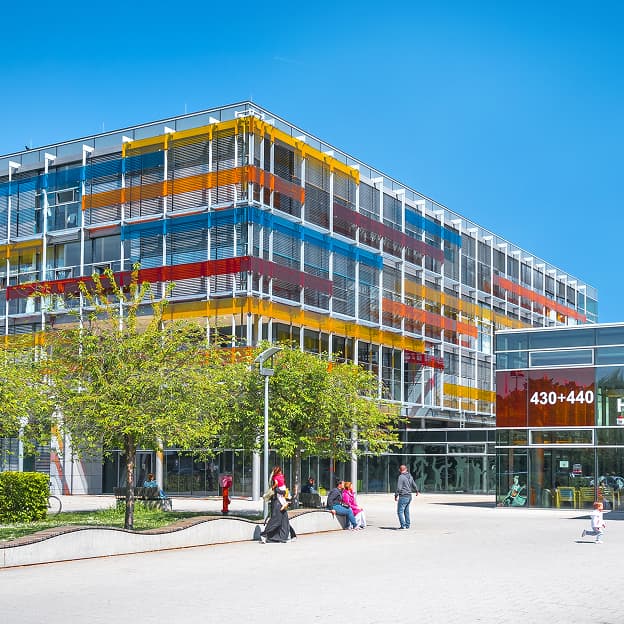 Exterior view of the children&rsquo;s hospital with its colorful glass facade.