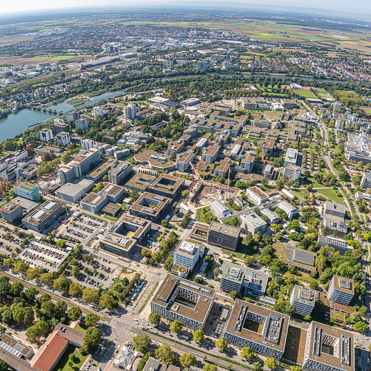 Aerial view of Neuenheimer Feld with hospital and university buildings and the Neckar river in the background
